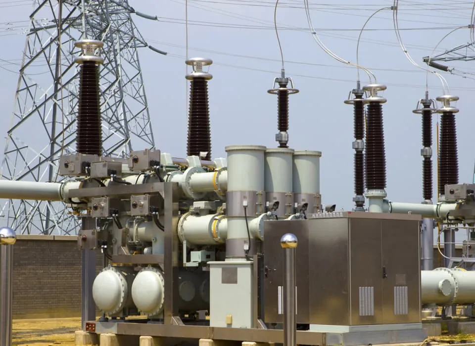 Outdoor high-voltage substation with GIS equipment and transmission towers